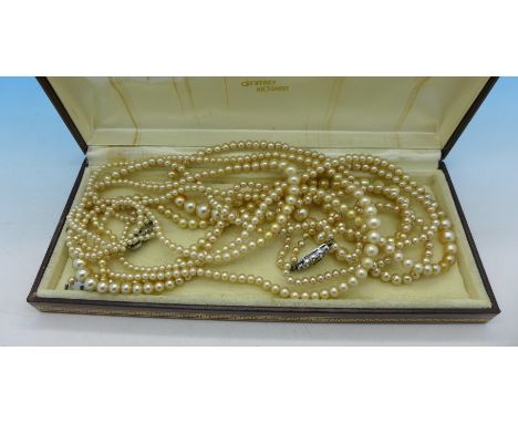 Three faux pearl necklaces