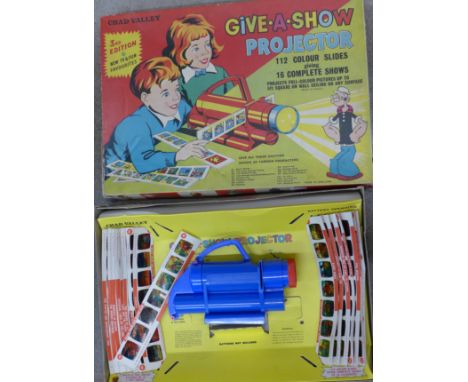 A Chad Valley Give-A-Show Projector with 112 colour slides including Stingray