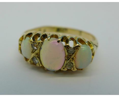 An 18ct gold, opal and diamond ring, 3.3g, P