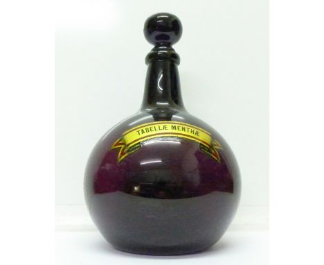 A 19th Century amethyst glass chemist carboy, 33cm including stopper