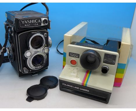 A Yashica Mat-124 camera and a Polaroid 1000 Land Camera