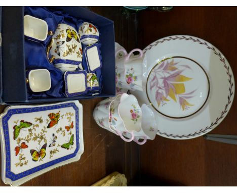 Six Shelley cups, one saucer, a hand decorated plate designed by Christine Chadwick and a miniature tea service, boxed