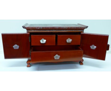 A Chinese jewellery cabinet set with mother of pearl