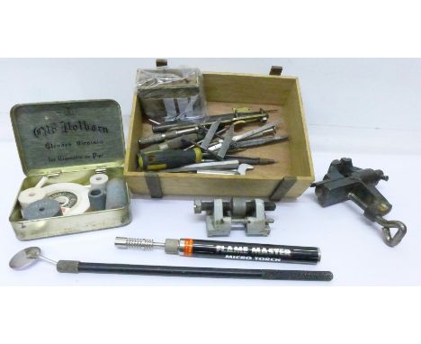 A hobby vice, tools, etc.