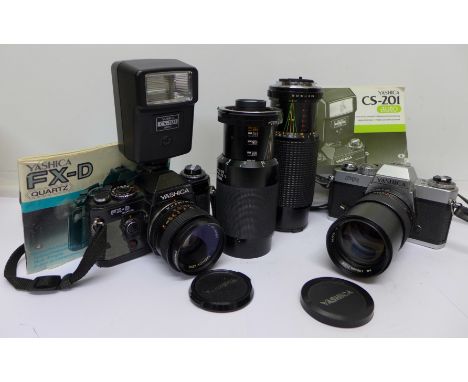 A Yashica FR and a FX-D Quartz camera, a Yashica f2.8 135mm, a Sunagor f5.6 75-300mm and a Tamron 80-210mm lens and a Yashica