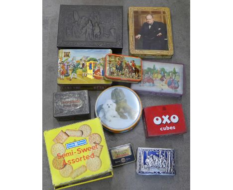 A collection of biscuit and toffee tins including one decorated with portrait of Sir Winston Churchill
