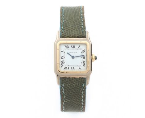 CARTIER SANTOS, ANNEES 70 Montre bracelet deux tons d'or 18K sur cuir. BOITIER : carré en or gris avec lunette vissée en or j