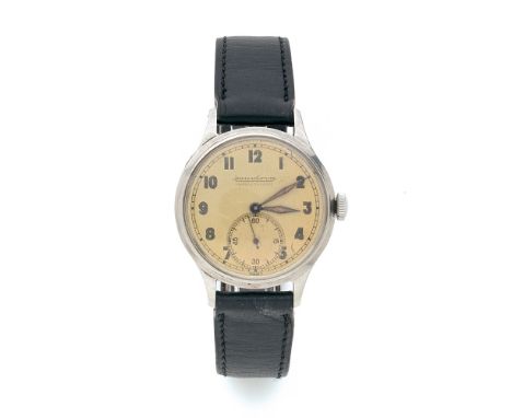 JAEGER LECOULTRE ANNEES 50 Montre bracelet en acier sur cuir.  BOÎTIER : rond. CADRAN : doré avec index chiffres arabes et mi