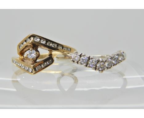 A 14ct gold cz set 'V' shaped ring size O, and a 9ct gold clear gem set ring size M1/2 Condition Report: Available upon reque