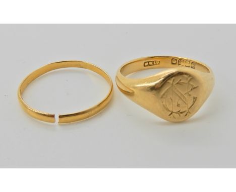 An 18ct gold monogrammed signet ring, size P, weight 5.4gms, and a 22ct gold wedding ring size approx Q (split to the shank) 