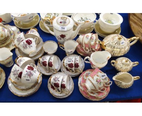 A Royal Stafford 'Roses to Remember' pattern coffee set and teawares comprising; coffee pot, six cups and saucers, milk jug a