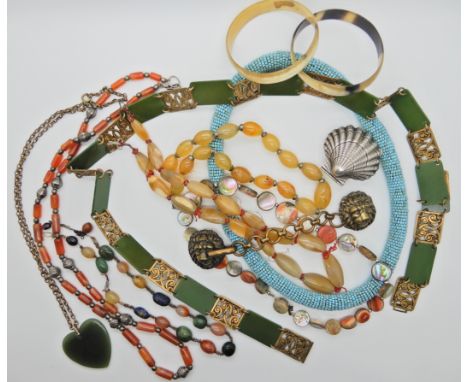 A lion head cloak clasp, carnelian beads, mixed gem beads, a cockle shaped trinket box and other items Condition Report: Not 