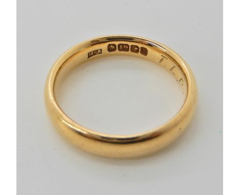 An 18ct gold court wedding ring, size M, weight 5.1gms Condition Report: Engraved to the inner shank. 