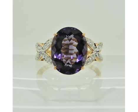 A 9ct yellow gold blueberry quartz and diamond dress ring, size N1/2, weight 2.9gms Condition Report: Available upon request