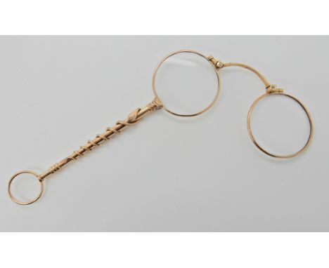 A 9ct gold pair of lorgnettes the stem with coiled snake detail, length 14cm, total weight including mechanism etc 25.4gms Co
