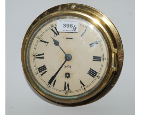 A Sestrel brass cased bulk head clock and modern barometer (2) Condition Report: Available upon request