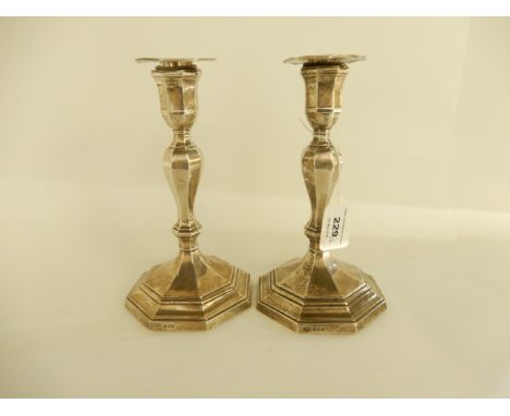 A pair of silver candlesticks by Goldsmiths & Silversmiths Co. Limited, London 1919, weighted, 21cm high Condition Report:Not