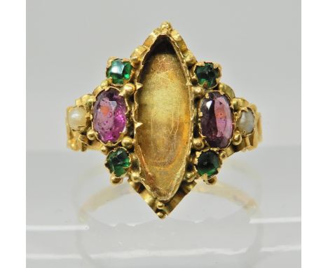 A 15ct gold garnet pearl and green gem set ring, central gem or possibly locket glass is missing. Dated Birmingham 1873, fing