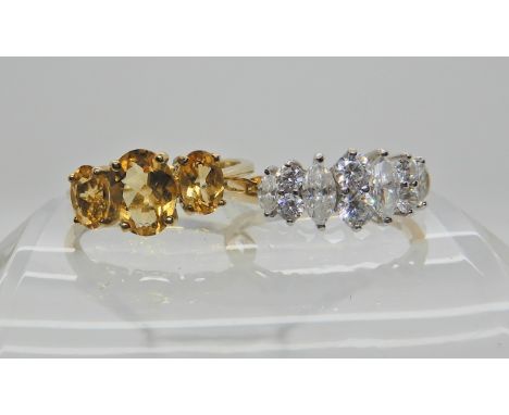 A 14k gold cz cluster ring size Q, weight 2.7gms and a QVC 9ct gold citrine set ring size O1/2, weight 2.3gms Condition Repor