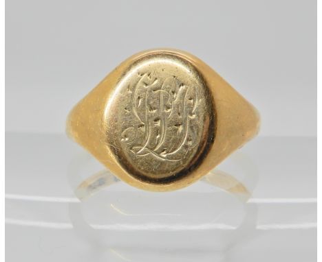 An 18ct gold monogrammed signet ring, size O1/2, weight 6.9gms Condition Report: Medium general wear. 