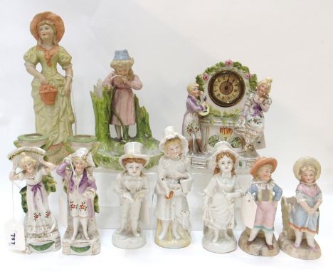 Ten Continental bisque and porcelain figures including a pair of candlesticks, 17cm high, mantel clock, 17cm high, pair of ta