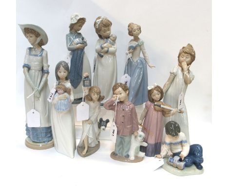 Ten Nao figures of children and ladies including boy with train, girls with dolls, girl playing violin etc, largest 31cm high