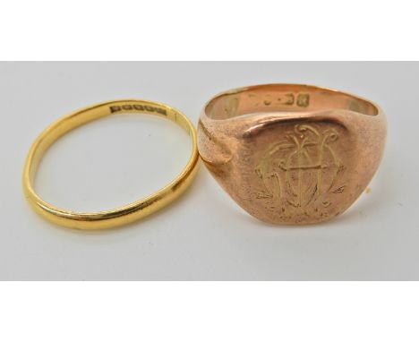 A 9ct rose gold monogrammed signet ring, size O1/2, weight 4.7gms, and a 22ct gold Glasgow hallmarked wedding ring size O1/2,