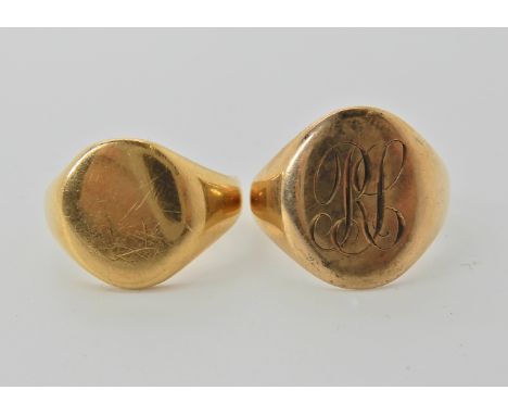 An 18ct gold signet ring size P1/2 weight 6.4gms and a yellow metal example size P, weight 5.4gms Condition Report: Both have