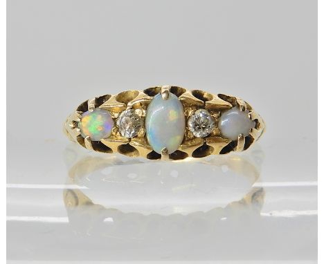 A bright yellow metal ring set with opals and diamonds, size M1/2, weight 3gms Condition Report: Mount all good opals scuffed