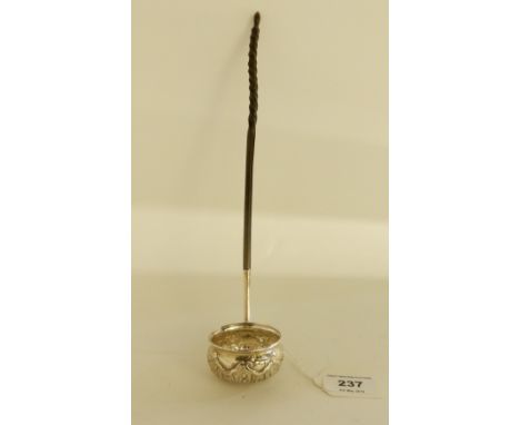 A coin set, white metal toddy ladle with whale bone handle, 32cm long Condition Report: Available upon request