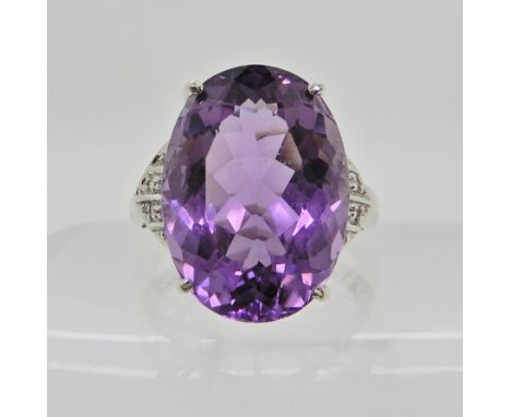 A 9ct white gold amethyst and diamond ring, size Q, weight 5.4gms Condition Report: Available upon request