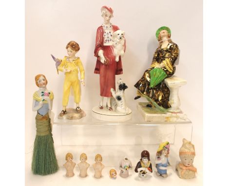 A Crown Charleston China figure April Showers (cracked), a Katzhutte pottery figure of a woman with dogs, Royal Worcester fig