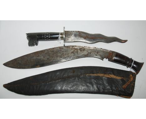 A Kukri in leather scabbard and middle eastern dagger (2) Condition Report: Available upon request