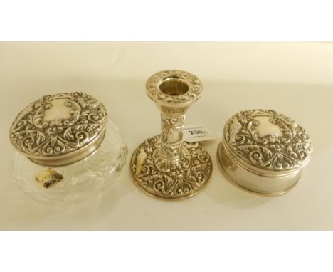 A part silver dressing table set comprising; silver jewellery box and candlestick, Birmingham 1954 and a silver topped talcum