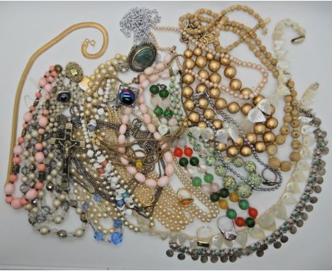 A bag full of vintage costume jewellery to include, a Max Neiger style yellow scarab ring, glass beads etc Condition Report:N