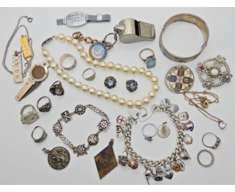 A silver enamel place name charm bracelet, a silver ingot pendant and other items Condition Report:&nbsp;Not available for th