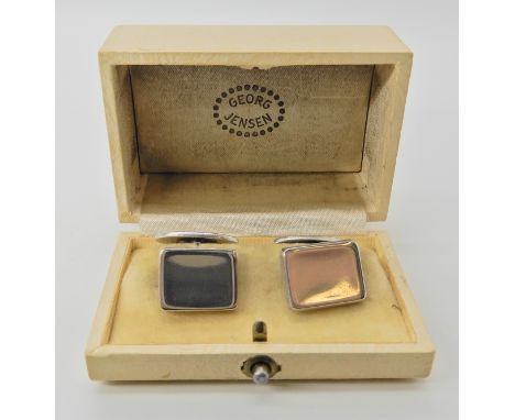 A pair of silver Georg Jensen cufflinks, pattern number 84. In original box Condition Report: Light general wear. 