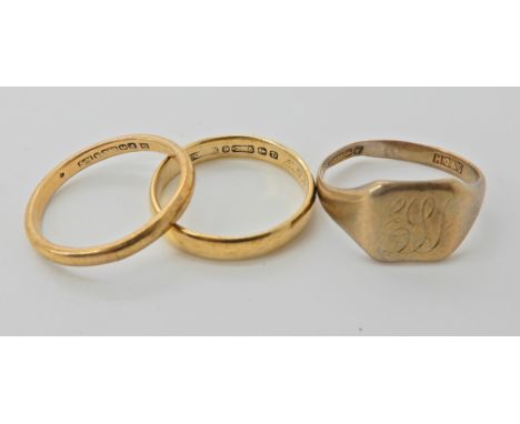 Two 9ct gold wedding rings sizes U and T1/2 and a 9ct signet ring size S1/2, weight for the three 9.3gms Condition Report: We