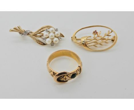 A 9ct red gem set brooch 3cm, a 9ct gold pearl and diamond flower brooch 3.8cm and a yellow metal green gem set buckle ring, 