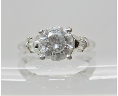 A platinum ring set with cubic zirconium, finger size O1/2, weight 4.4gms Condition Report: Light general wear. 