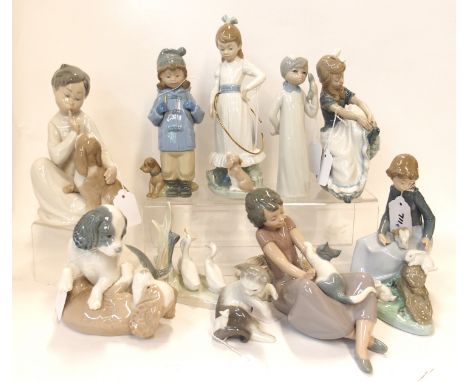 Lladro boy and puppy, a kitten and mouse, seven Nao figures and another figure (10) Condition Report: Available upon request