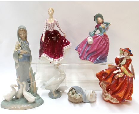 Three Royal Doulton figures 'Fiona' HN2694, 'Autumn Breezes' HN4716 and 'Top o'the Hill' HN4778, two Lladro and a Nao figure 