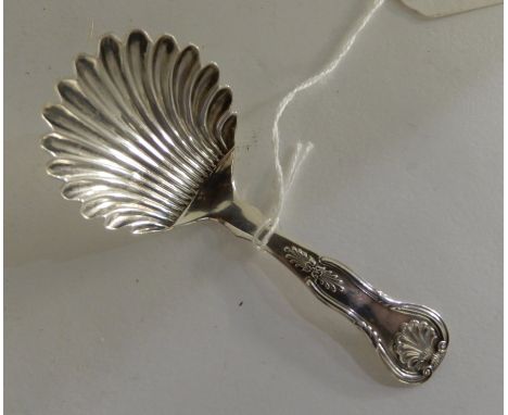 A silver caddy spoon with shell shaped bowl by R L Christie, Edinburgh 1866, 10cm long, 15gms Condition Report: Available upo