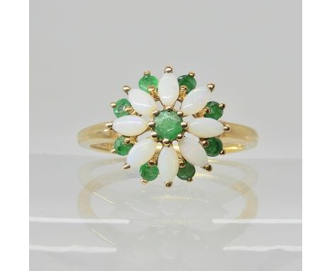 A 9ct gold opal and emerald flower ring, head size 12mm, finger size O1/2, weight 2.3gms Condition Report: light general wear