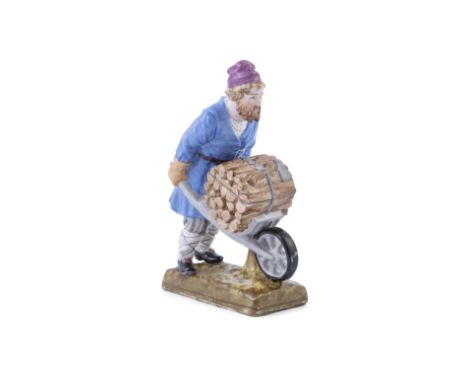 A RUSSIAN 'GARDNER' PORCELAIN FIGURE OF A WOODCUTTER WITH WHEEL BARROW, Moscow, modelled in blue garb with cerise hat, pushin