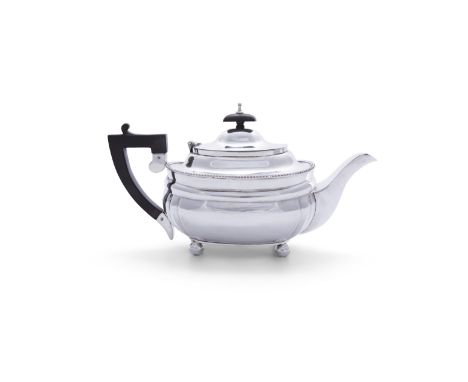 AN IRISH SILVER TEAPOT, Dublin c.1955, mark of West &amp; Sons, of shaped rectangular form, the hinged lid with ebon finial, 