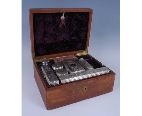 A William IV gents leather bound travelling toilet box complete with outer leather travel case, the whole fitted with an arra