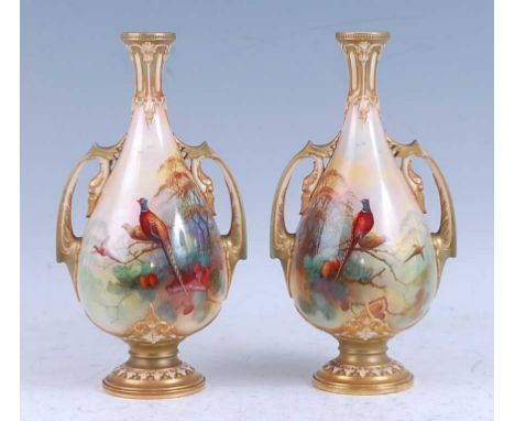A pair of 1910 Royal Worcester porcelain vases, each of pear shape and flanked by twin handles, hand-painted with pheasants a