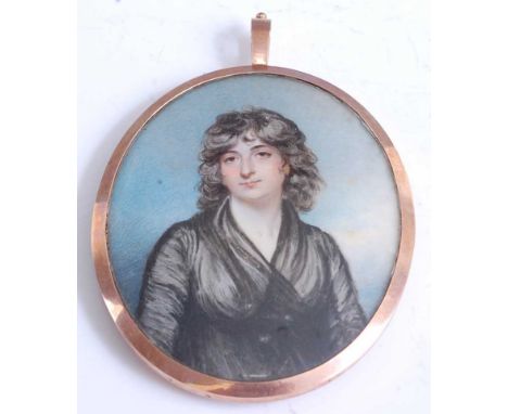 A large Georgian double-sided portrait mourning locket, one side being a miniature watercolour on ivory depicting head and sh