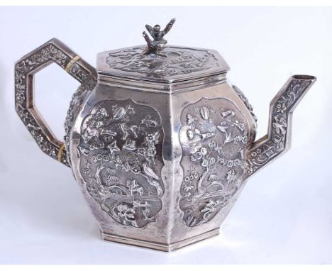 An early Victorian silver teapot, of hexagonal form with angular shaped handle and spout, all-over profusely repousse decorat